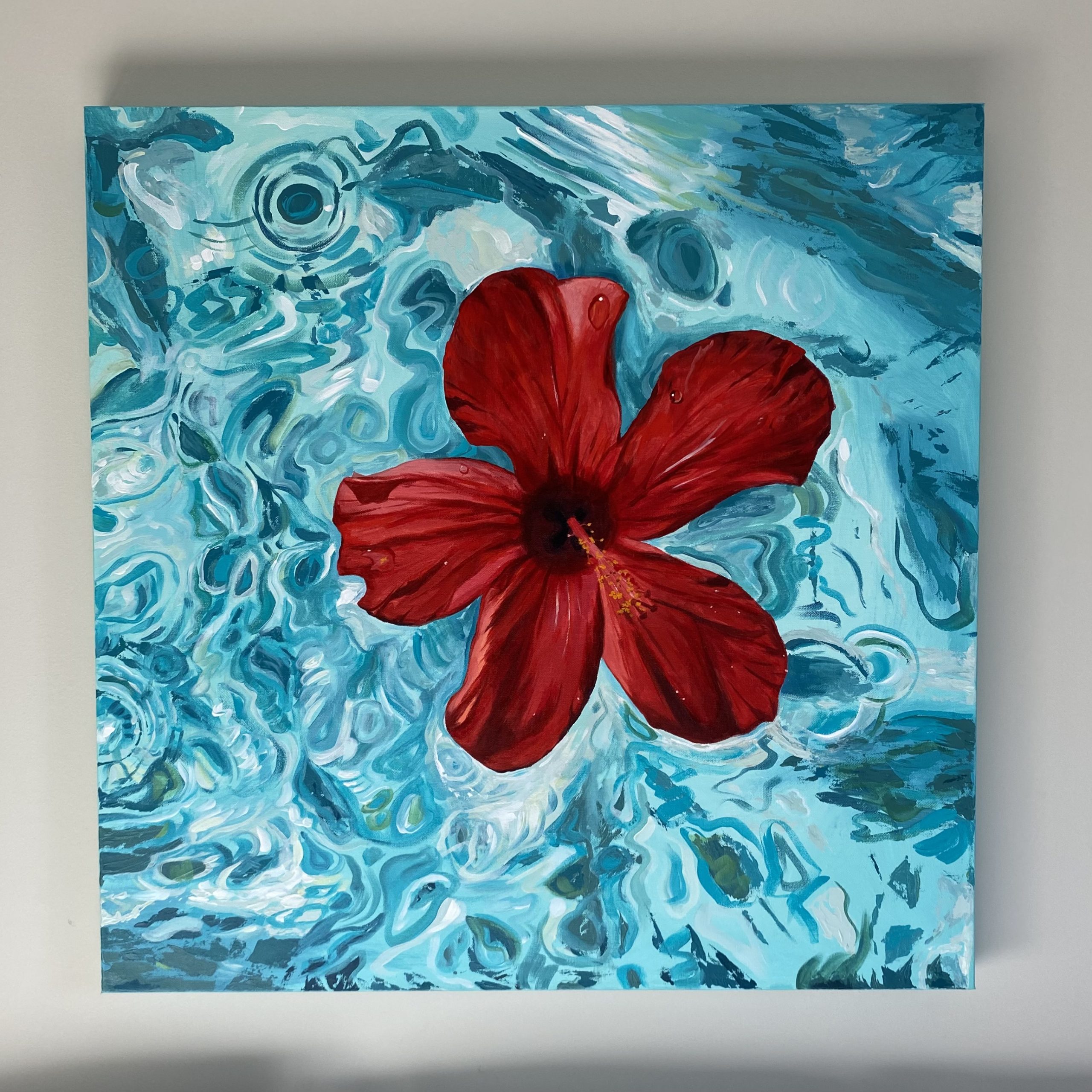 Painting of a hibiscus flower floating in water